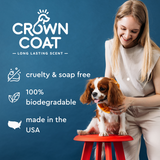 Crown Coat branding with a smiling woman holding a Cavalier King Charles Spaniel on a red stool, highlighting cruelty and soap-free, biodegradable and USA-made benefits