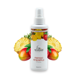 Front view of Seasonal Scents Mango Pineapple Cologne 8 oz bottle, displayed with fresh mangos and pineapples