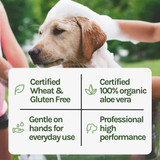 Dog being bathed, featuring Envirogroom branding and key product benefits: certified wheat and gluten free, certified 100% organic aloe vera, gentle on hands for everyday use and professional high performance