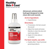 Two bottles of Healthy Skin + Coat antimicrobial spray with product information and directions for wound and skin care.