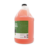 Side view of Bark2Basics Deodorizing Shampoo gallon jug, showcasing product label with ingredients and description