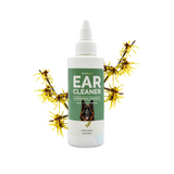 4 oz bottle of Bark2Basics Dog Ear Cleaner, surrounded by witch hazel twigs