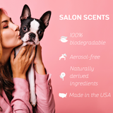 Woman holding and kissing a Boston Terrier, with Salon Scents branding and key product benefits: 100% biodegradable, aerosol-free, naturally derived ingredients and made in the USA