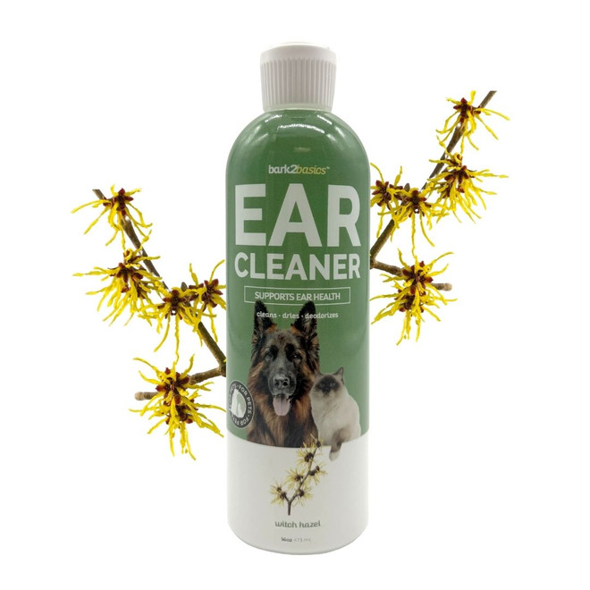 16 oz bottle of Bark2Basics Ear Cleaner surrounded by witch hazel twigs