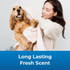 Woman drying a happy dog with a towel after a bath. Text on image reads: ‘Long Lasting Fresh Scent.’