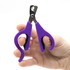 SureGrip Small Comfort Grip Dog and Cat Nail Clippers, slightly closed, in human hand