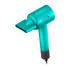 Angled aerial view of the Artero Candy Handheld Dryer, Turquoise, shown with the magnetic nozzle attached
