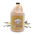 Gallon jug of Bubble Bros. Brightening Shampoo, displayed with vanilla pods and flowers