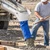 Contractor using a Poly Concrete Hopper with Pipe and 5' Blue Elephant Trunk on site.