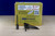 Box of Little Johnson reusable concrete formwork screws with three screws displayed in front, featuring square duplex heads and chisel-point tips for concrete stake and form board fastening.