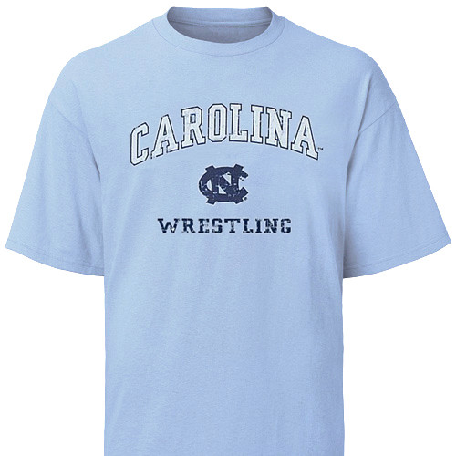 Carolina Blue Vintage Wrestling Tee - arc Carolina over an interlocking NC over Wrestling