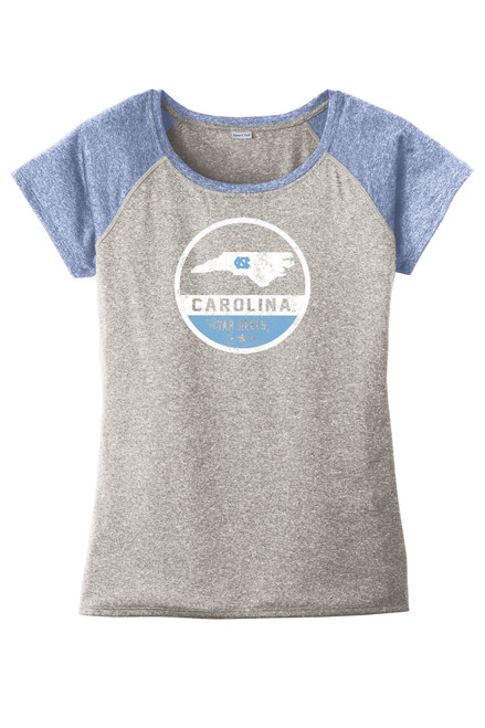 Raglan performance tee with heather navy sleeves and a heather gray body.  Design is a Carolina blue and white circle with the state of North Carolina and the lettering "Carolina Tar Heels."