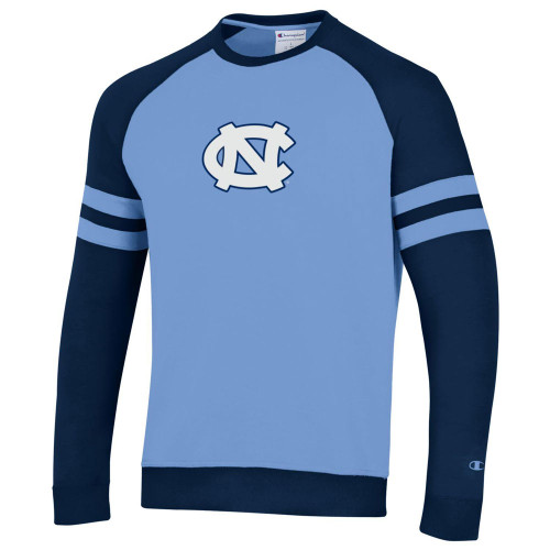 Carolina Blue body with navy sleeves and big interlock NC on the chest.