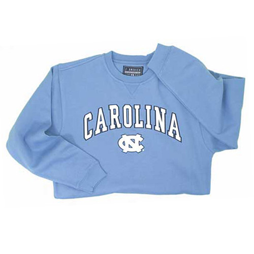 Carolina blue crewneck sweatshirt with Carolina in an arc over the interlocking NC.