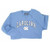 Carolina blue crewneck sweatshirt with Carolina in an arc over the interlocking NC.