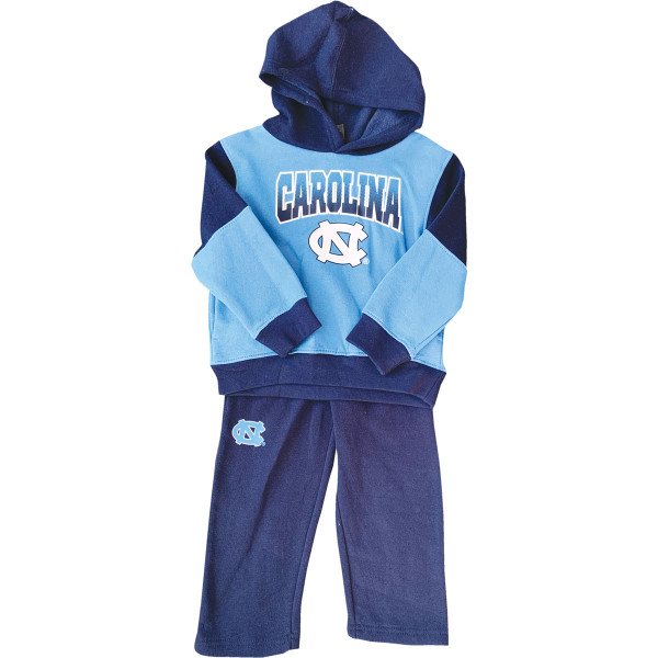 Hooded sweatshirt that is Carolina Blue and navy with arc Carolina over an interlock NC design. Navy sweatpants with interlock NC on the right thigh.