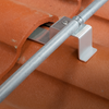 Pegasus Tile Conduit Mount on a terracotta tile roof securely holds metal conduit with an aluminum bracket for a clean, professional solar installation.
