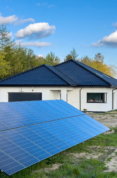 Ground Mount panels mounted in yard outside of home.