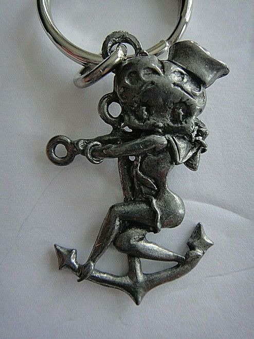 A new Betty Boop "Sailor"  Pewter Embossed  Key Chain.  2 inches tall but 3 inches tall overall. 

Please note we will always combine shipping on like items.  Any additional patch or pin will ship for 50 cent per item.  Any additional payment will be reimbursed to your Paypal account.  Thank You.