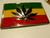 New metal Marijuana African Flag Enamel Enamel Belt Buckle     The features are raised to allow the different enamel colors.   The belt buckle measures 4 inches wide by 2.5 inches tall.  The buckle will accommadate a belt strap upto to 1.5 inches wide.   A web belt or any belt strap is not included,  only the buckle described.   You will not be disappointed by this choice. 

Please note we will always combine shipping on like items.  Any additional patch or pin will ship for 50 cent per item.  Any additional payment will be reimbursed to your Paypal account.  Thank You.