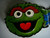 New metal Sesame Street "Oscar the Grouch" Enamel Belt Buckle     The features are raised and filled in with the different enamel colors.   The belt buckle measures 4 inches wide by 3.25 inches tall.  The buckle will accommodate a belt strap upto to 1.5 inches wide.   A web belt or any belt strap is not included,  only the buckle described.   You will not be disappointed by this choice. 

Please note we will always combine shipping on like items.  Any additional patch or pin will ship for 50 cent per item.  Any additional payment will be reimbursed to your Paypal account.  Thank You.