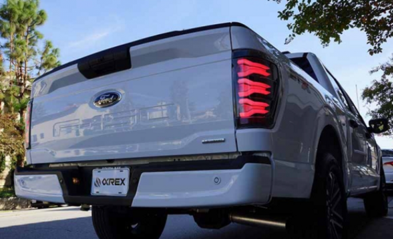 AlphaRex Luxx Series Black/Red LED Tail Lights 2021 to 2023 Ford F150 (Without Blind Spot Monitor) (653030)-In Use View