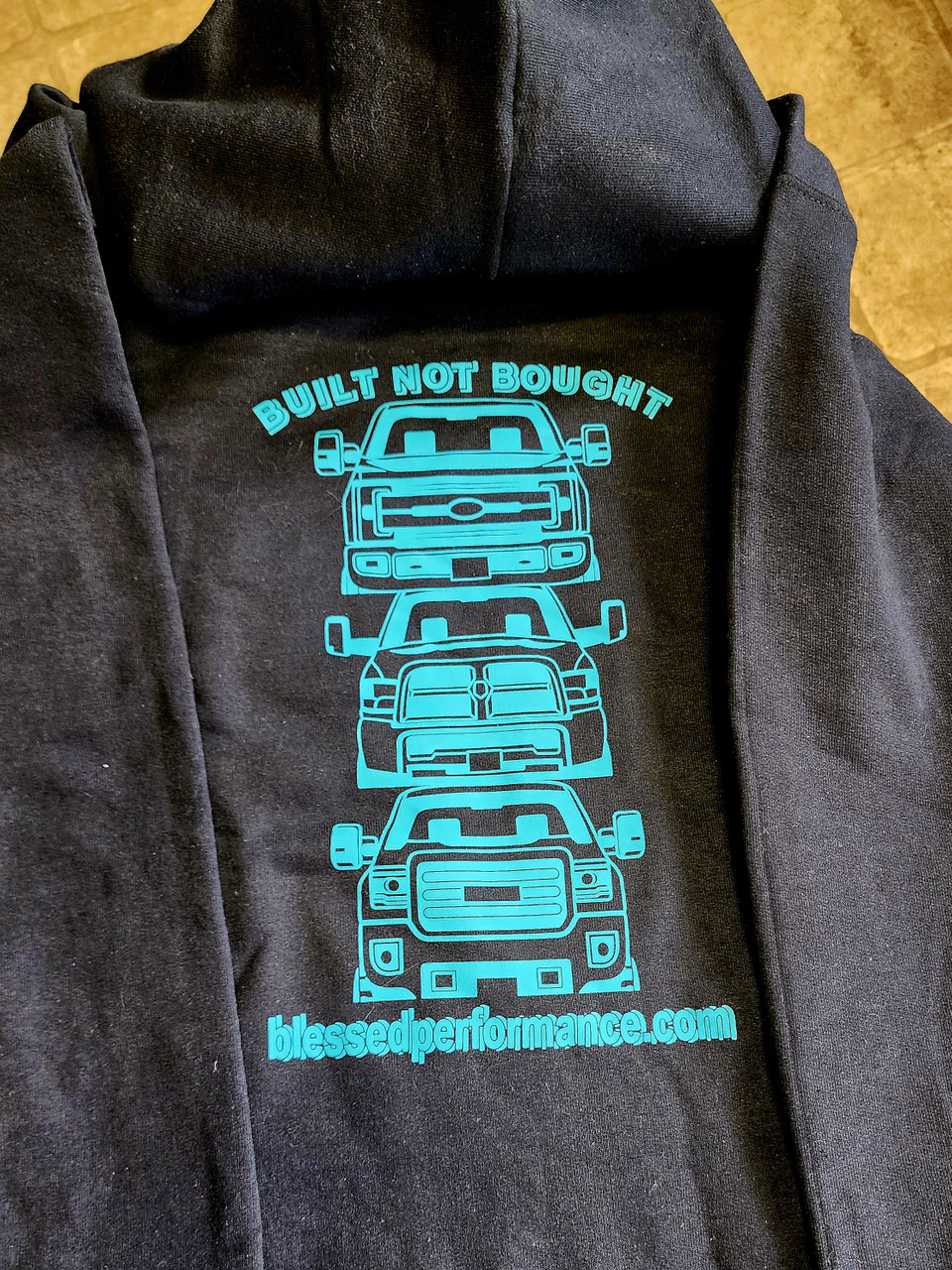 Built Not Bought Truck Grille Hoodie Teal on Black (BPTruckHoodieTB) Back View