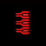 AlphaRex LUXX Series Alpha Black LED Tail Lights 2014 to 2018 GM Sierra 2500HD/3500HD (630030)-Night View 1 