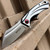 8" Chrome Stainless Steel Assisted Pocket Knife w/ Chrome Handle & Red Accent
