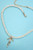 Gold Ribbon Bow Quartz Necklace
