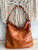 2 Side Metal Accent Brown Hobo Bag