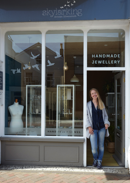 Ruth standing outside her store