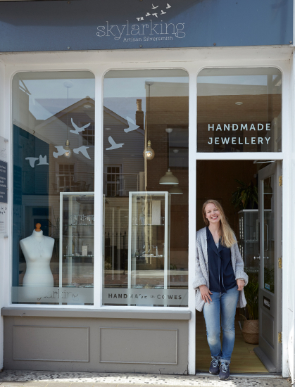 Ruth standing outside her store