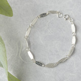 Leaf link bracelet handmade in solid sterling silver.