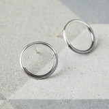 Half dipped circle earrings. Sterling silver circle studs with half black surface.