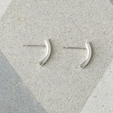 Solid silver curved stud earrings.