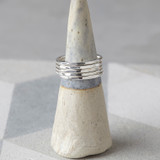 Five stacking rings with dappled texture.