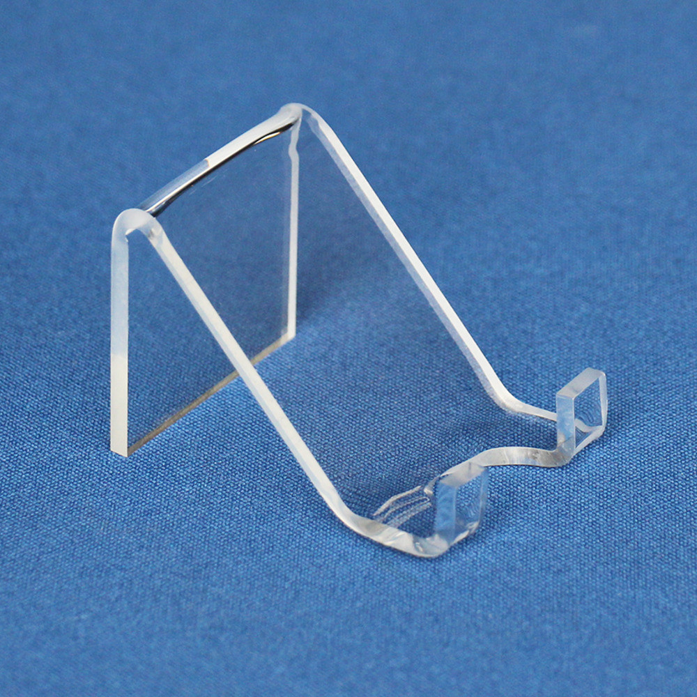 2 inch clear acrylic paperweight display stand easel side view with blue background