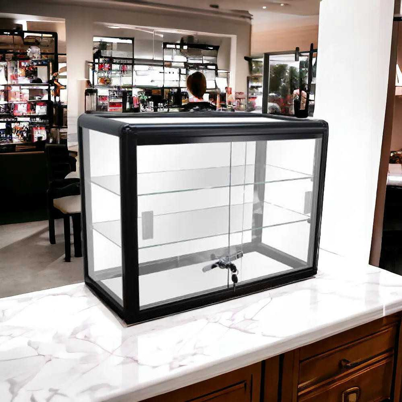 Black glass countertop display case for rent, shown on retail counter with lock and shelves, ready for use at events