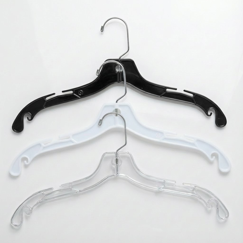 Three plastic top hangers in black, white and clear with chrome swivel hooks and notched shoulders for straps