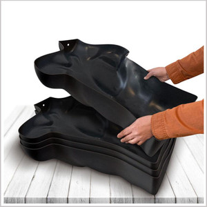 Black torso mannequins stacked into each other for storage