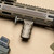 RailScales RSB® vertical grip in Terra Bronze, QTR™ Stop in Terra Bronze, 4-Slot Matrix Texture G10 TerraCore® RailScales, 1.5-Slot Matrix Texture TerraCore® G10 Solo's™ | Noveske NSR-SD NSD-N4-11 rail in FDE