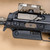 RailScales® MP7 GIP MLOK Rail in Carbon Black®, 1-Slot Matrix TerraCore® G10 Solo's™ M-LOK Scale, RailScales Half Slot MLOK Sling Mount | Heckler and Koch MP7A1 Post Sample MG, B&T USA MP7 Compact Rotex Suppressor, L3Harris NGAL-A1 Laser w/ Pressure Pad, Surefire M340V-Pro Scout Light Pro IR Weapon Light w/ CSM-07 MLOK Pressure Switch.