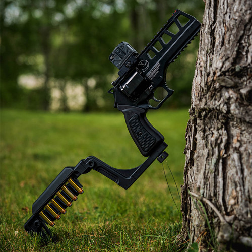 The Bounty Hunter Chiappa Rhino Large Frame Stock on a revolver resting on a tree, right side. Product made by Midwest Industries.