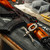 Photo of a firearm and the AK Multi Tool on the Gun Mat Lever Action Series 36x12. Product sold by Midwest Industries.