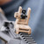 A Flat Dark Earth MBUS 3 Sight - Rear attached to a Rifle end. Product made by Magpul Industries.
