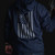 Back side of a Flag Hoodie in Navy lifestyle image.