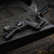 The Bounty Hunter Chiappa Rhino Small Frame Stock & Arm Brace on a revolver resting on a tailgate. Product made by Midwest Industries.