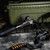 The Bounty Hunter Thompson Center Stock & Arm Brace on a rifle that’s resting on a tailgate. Product made by Midwest Industries.