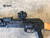 A Gen 2 AK Side Mount with a MRO Interface attached to a rifle. Product made by Midwest Industries.